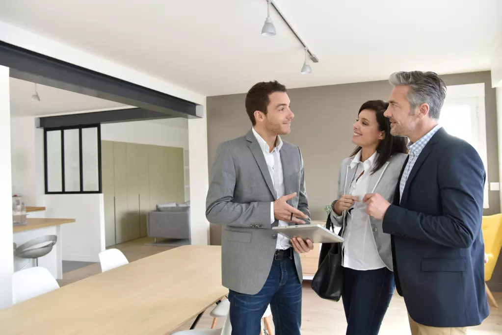 Couple with agent visiting house